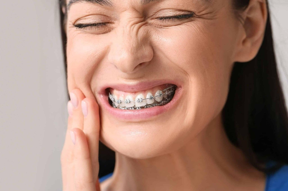 Monthly adjustments cause mild soreness for 1–3 days (peaking within 24h), which lessens over time